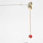 Hoop inlaid with red stone